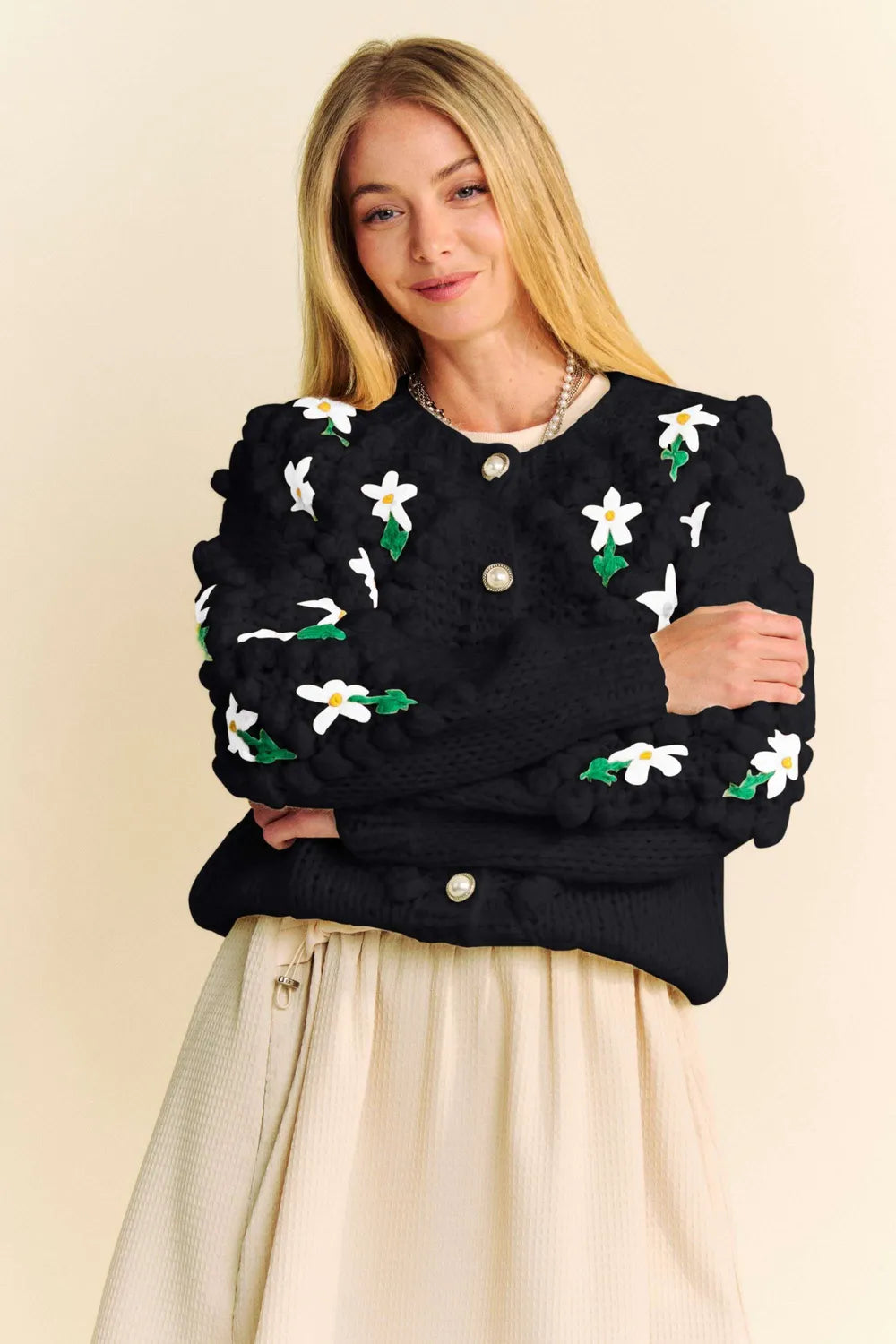 Black cropped Davi & Dani cardigan with puff sleeves and daisy embroidery