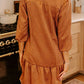 Rust-colored herringbone texture dress with ruffled hem and zip front