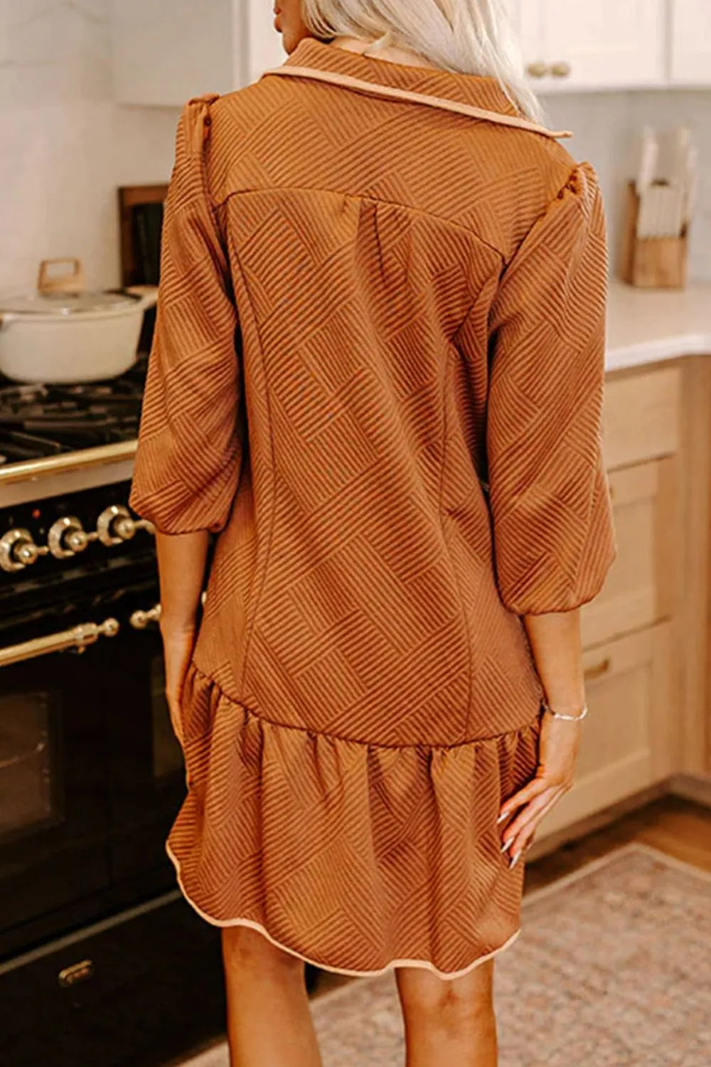 Rust-colored herringbone texture dress with ruffled hem and zip front