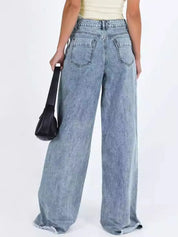 Wide-leg light blue denim jeans with frayed hems, high waist and pockets