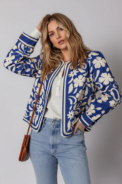 Blue and white floral print bomber jacket with striped trim and buttoned cuffs