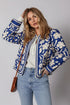 Blue and white floral print bomber jacket with striped trim and buttoned cuffs