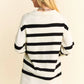 Woman in Davi & Dani striped high-low side slit johnny collar sweater
