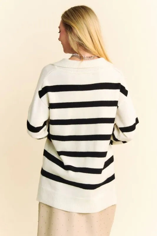 Woman in Davi & Dani striped high-low side slit johnny collar sweater