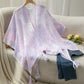 Delicate lavender Daverri openwork tassel gradient knit shawl with subtle gradient and trim