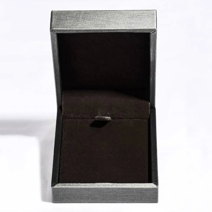 Black jewelry box with a silver lid on a white background
