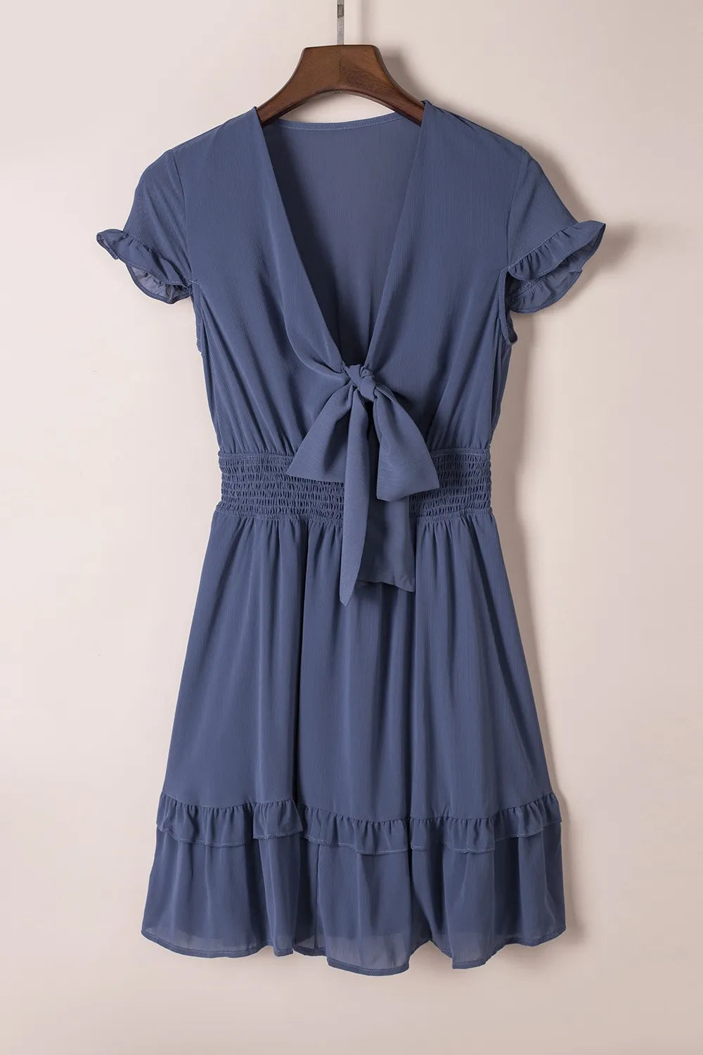 Soft blue chiffon tie-front mini dress with smocked waist and ruffled sleeves