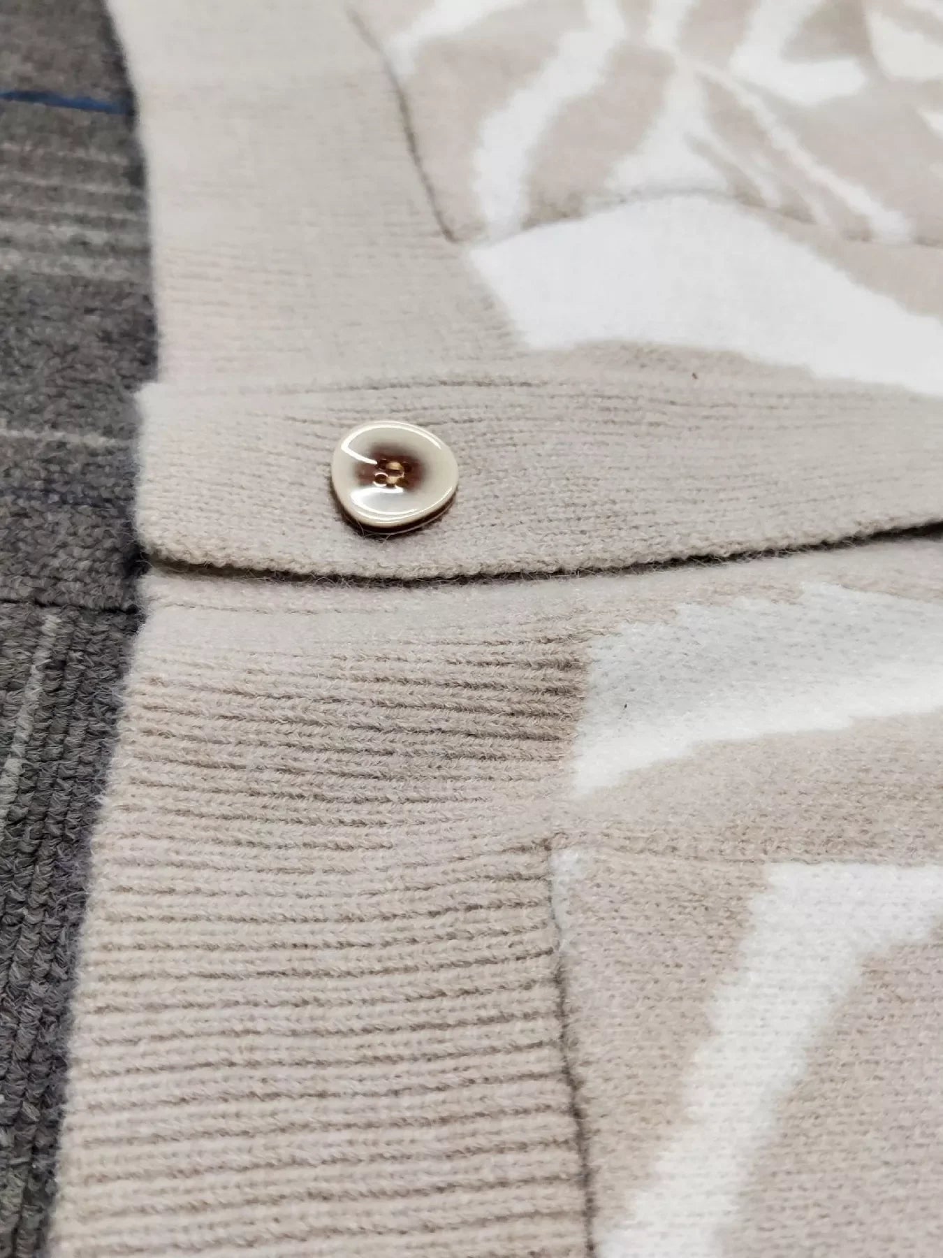Beige textured button on zebra print cardigan sweater