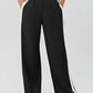 Black wide-leg pants with white side stripes and high waistband