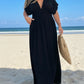 Black flowing maxi dress with deep V-neck, flutter sleeves, side slit, plus size by Daverri Fashions