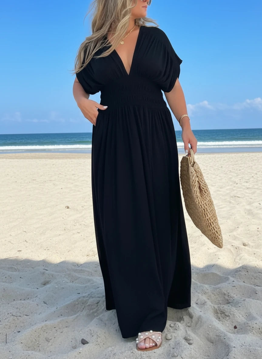Black flowing maxi dress with deep V-neck, flutter sleeves, side slit, plus size by Daverri Fashions