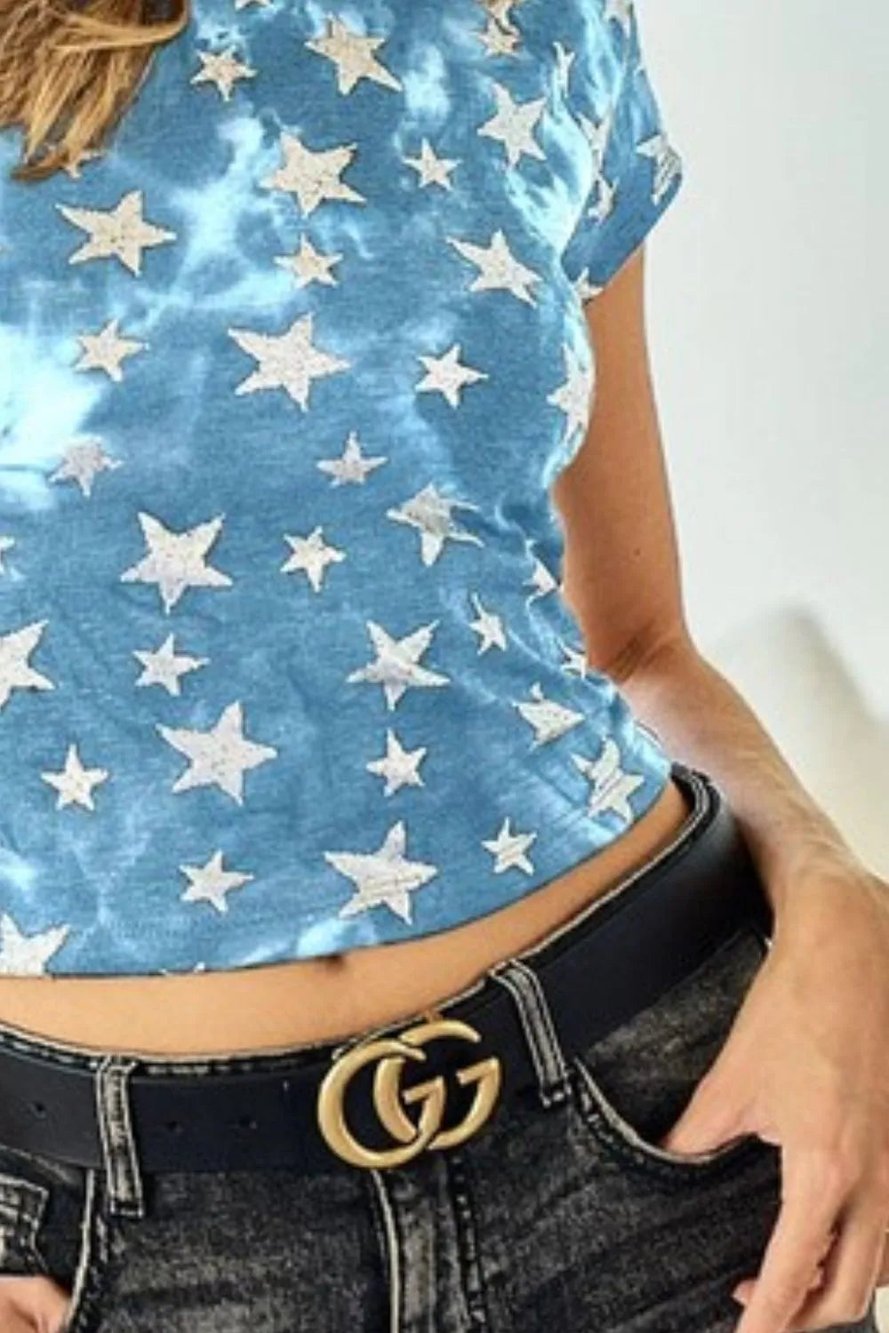 Black leather belt with gold-tone Gucci double G buckle