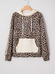 Leopard print long sleeve hoodie with cream accents, pocket, drawstring hood