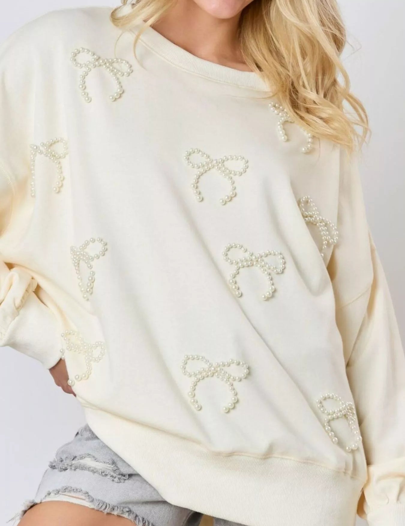 Ivory Pearl Embellished Bow Long Sleeve Sweatshirt | Sweatshirts Daverri Fashions