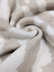 Beige and white zebra striped plush button-up cardigan