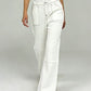 White wide-leg denim pants with contrast stitching and flared hem