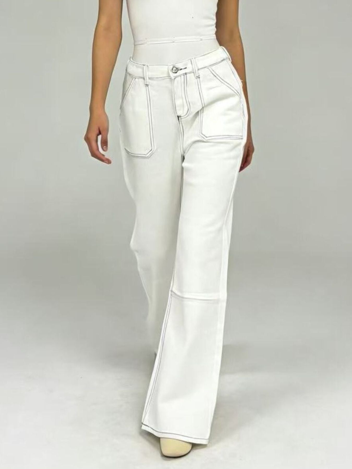 White wide-leg denim pants with contrast stitching and flared hem