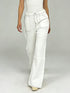 White wide-leg denim pants with contrast stitching and flared hem