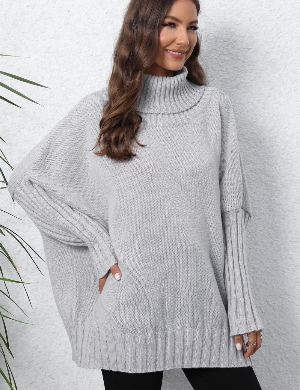 Light gray oversized turtleneck ribbed sweater with side slits