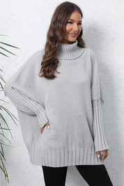 Light gray oversized turtleneck ribbed sweater with side slits