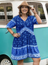 Plus size floral V-neck mini dress in blue with white trim