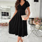 Black surplice v-neck midi dress with short puffed sleeves and flared skirt