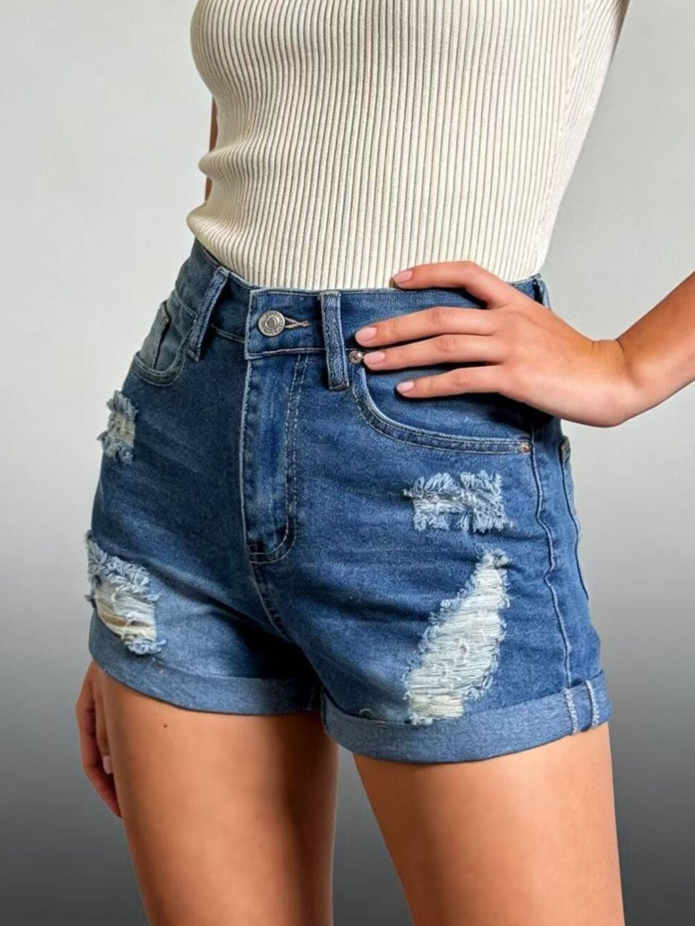 Daverri Distressed High-Waisted Denim Shorts with frayed patches and rolled cuffs