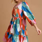 Umgee Abstract V-Neck Tiered Printed Dress - DAVERRI FASHIONS