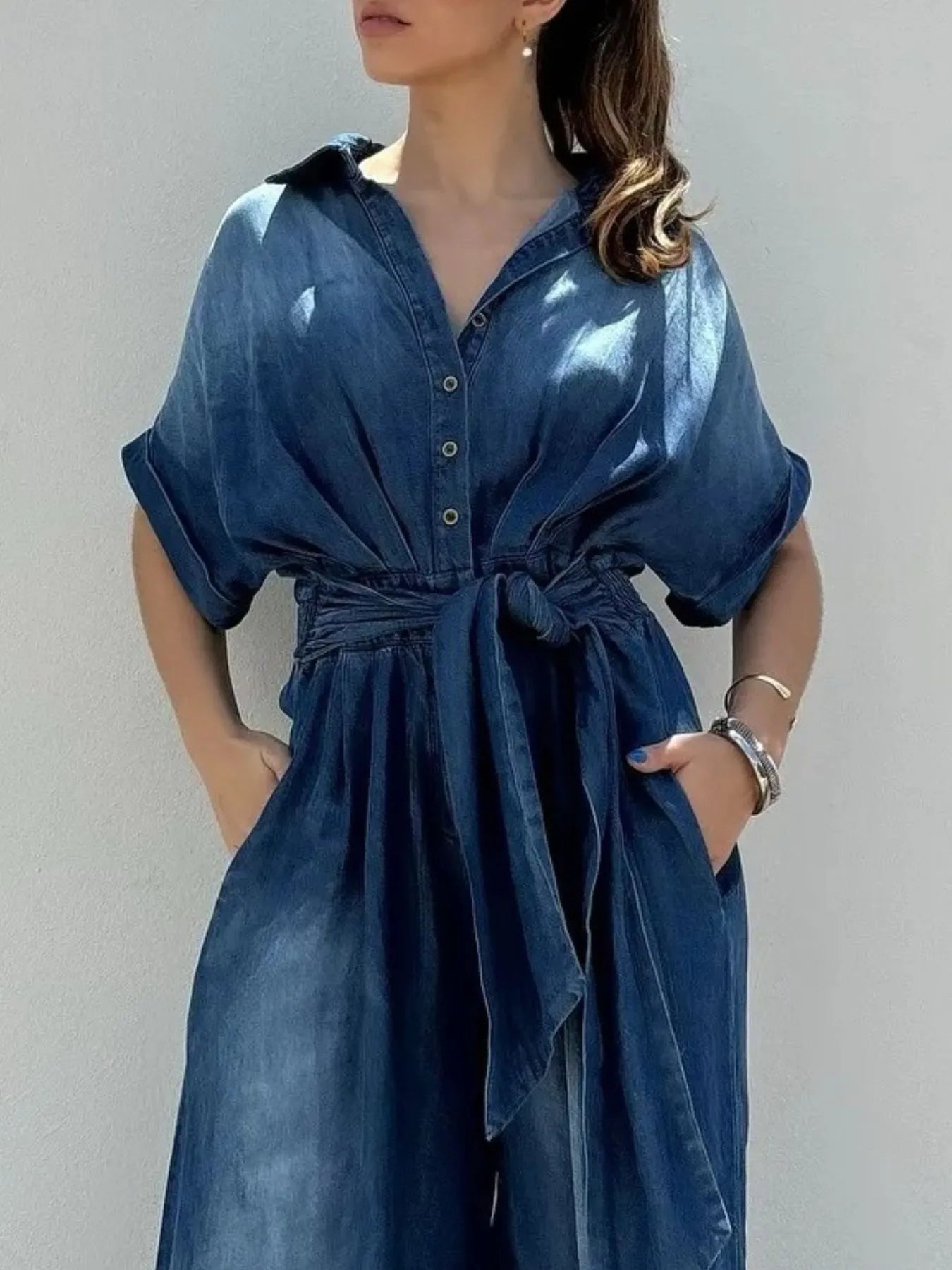 Daverri Fashions button-front wide-leg denim jumpsuit with short sleeves and tied waistband