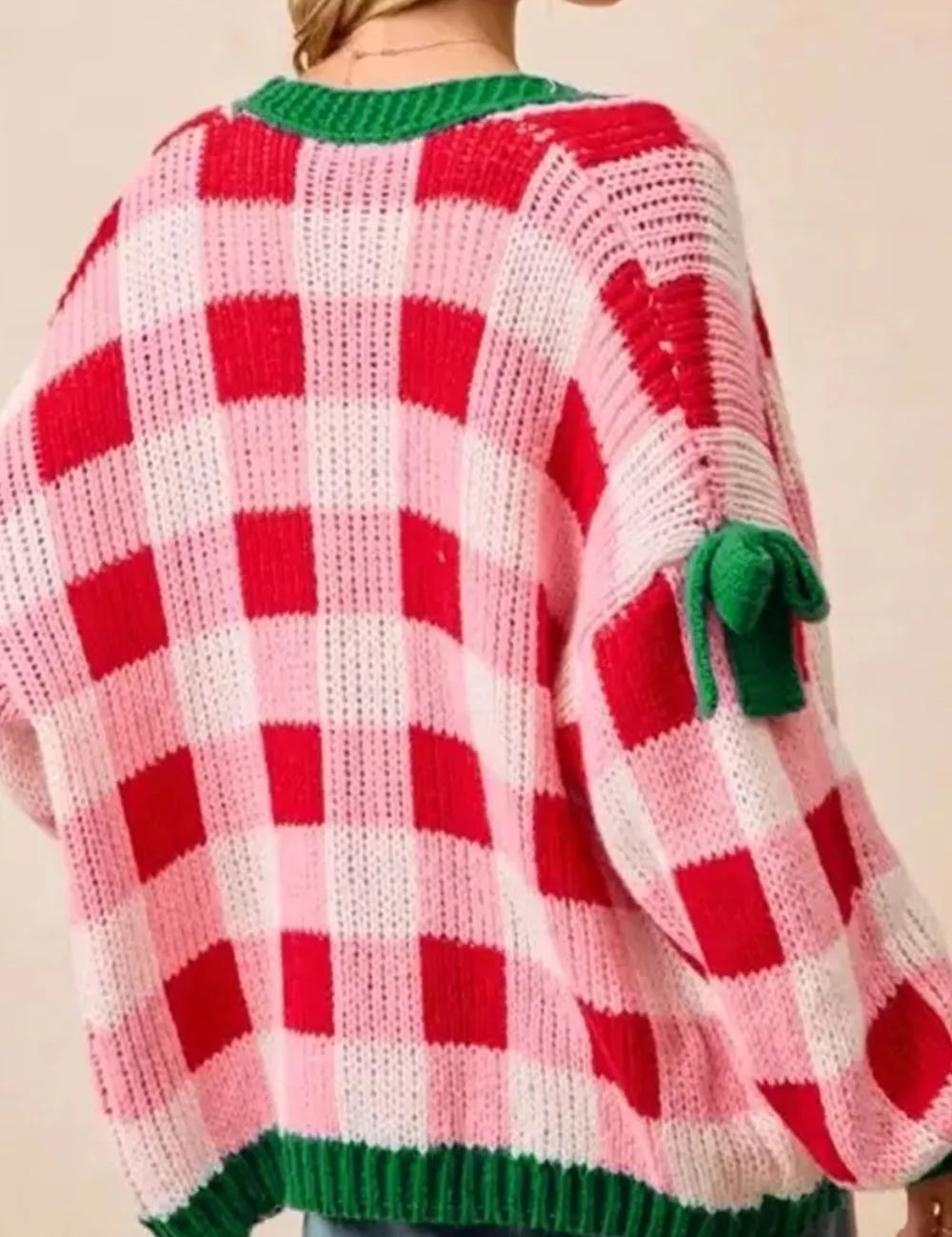 Oversized red and white checkered Christmas cardigan with green trim