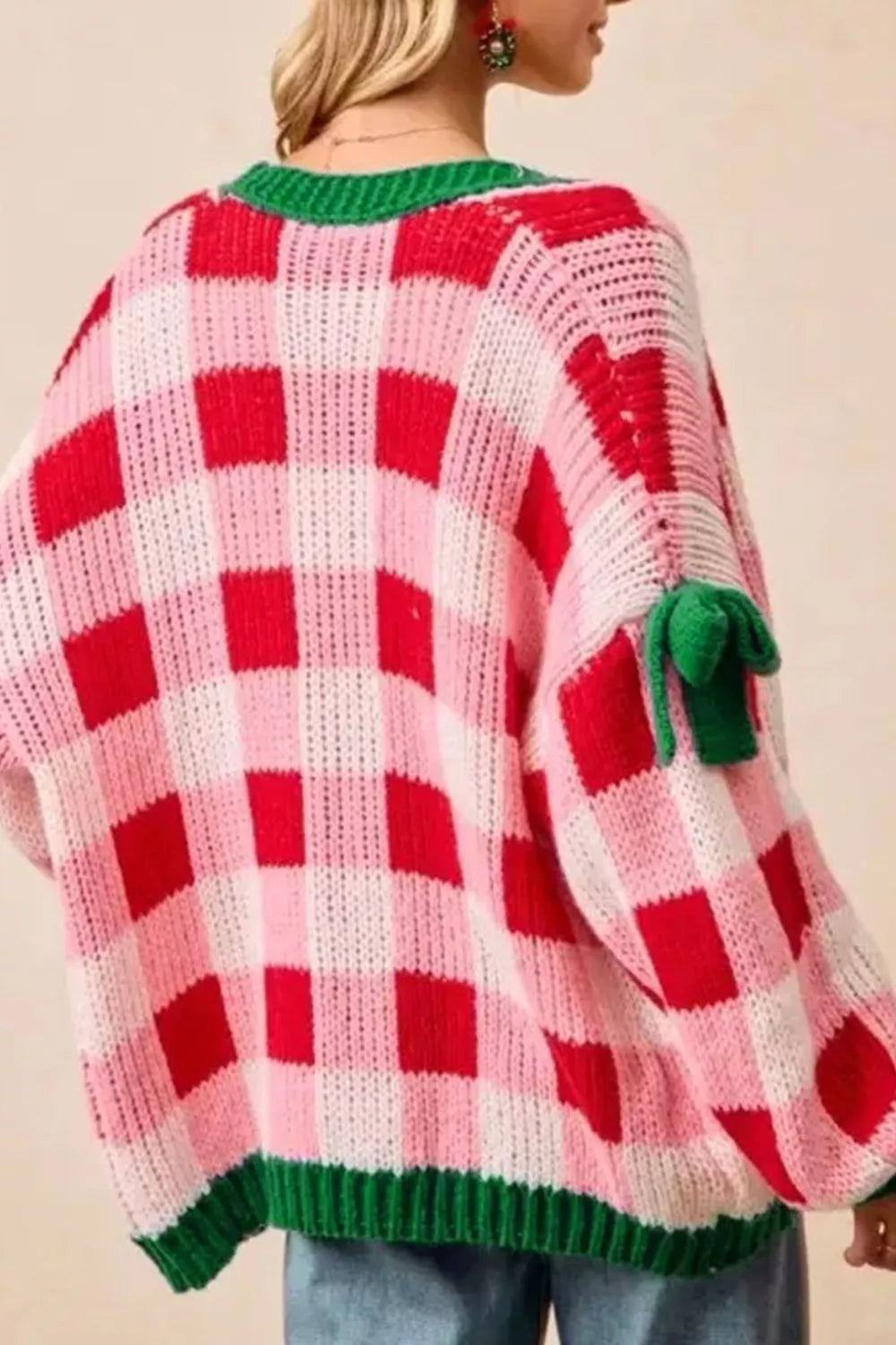 Oversized red and white checkered Christmas cardigan with green trim