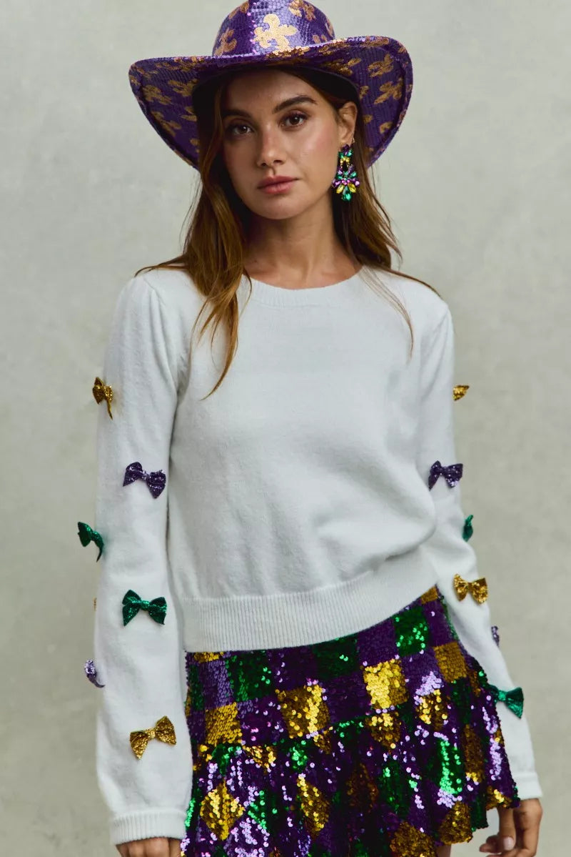 SO ME Mardi Gras white knit sweater with colorful sequined bows on sleeves