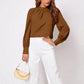 Tan ruched mock neck long sleeve blouse with gathered collar