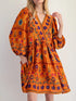 Bohemian floral print long sleeve mini dress with orange puff sleeves and v-neck