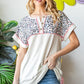 Heimish Full Size Exposed Seam Leopard Short Sleeve T-Shirt Oatmeal