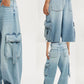 Vintage wash wide leg cargo jeans in light-wash denim with pockets