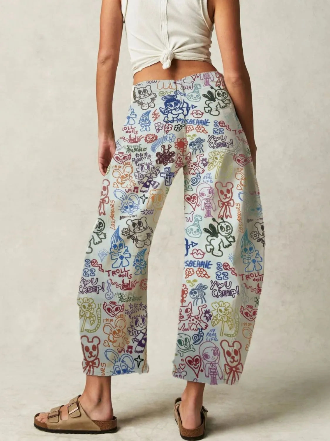 Printed wide-leg jeans in white with colorful graffiti cartoon print