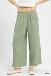Sage-colored Umgee Frayed Hem Wide Leg Pants with textured fabric and frayed hems