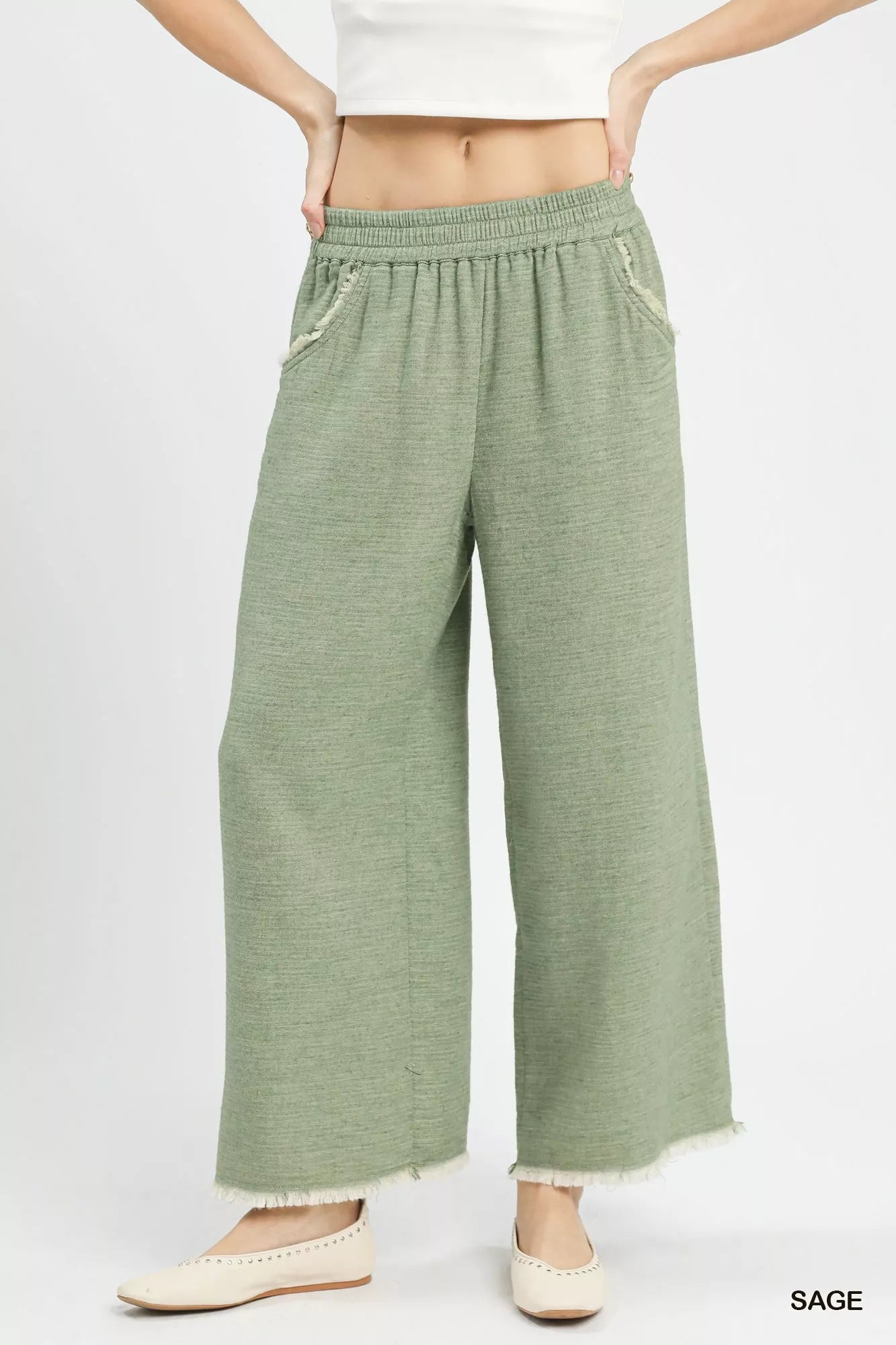 Sage-colored Umgee Frayed Hem Wide Leg Pants with textured fabric and frayed hems
