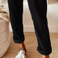 Black Daverri corduroy drawstring pants with rolled cuffs