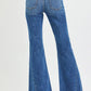 Back view of RISEN mid-rise flare jeans in blue denim with frayed hems