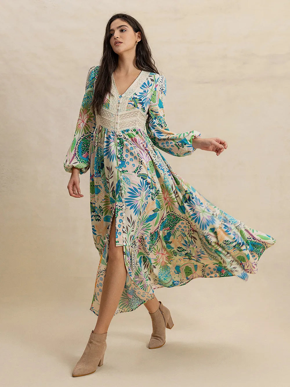 Slit printed V-neck long sleeve floral maxi dress in vibrant greens, blues, pinks on cream base with lace-trimmed bodice