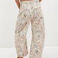 Printed wide leg jeans in beige denim with subtle gray and pink cat print