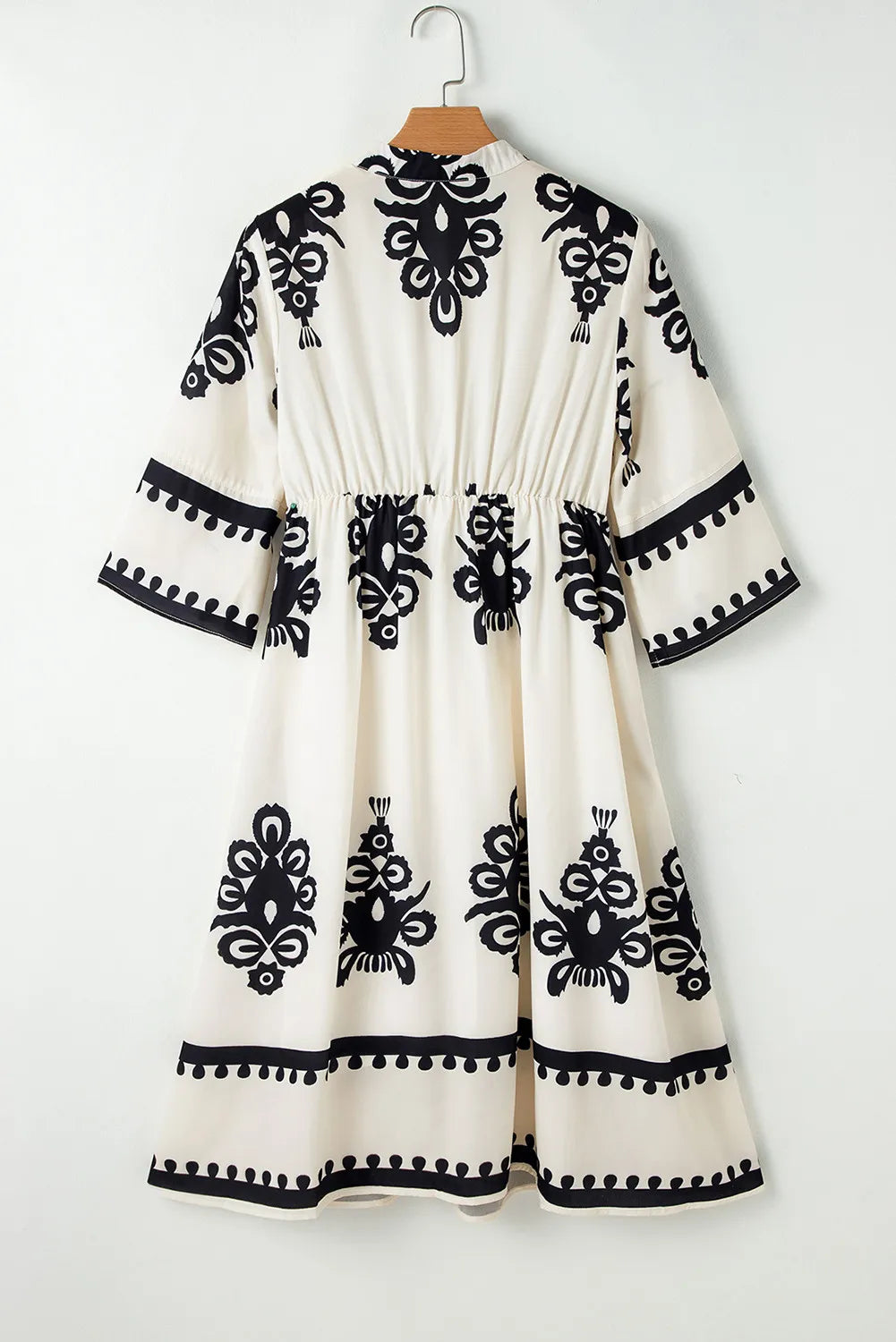 White and black embroidered printed dress with bell sleeves