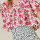 Pink floral boxy fit ruffled short sleeve blouse with v-neckline
