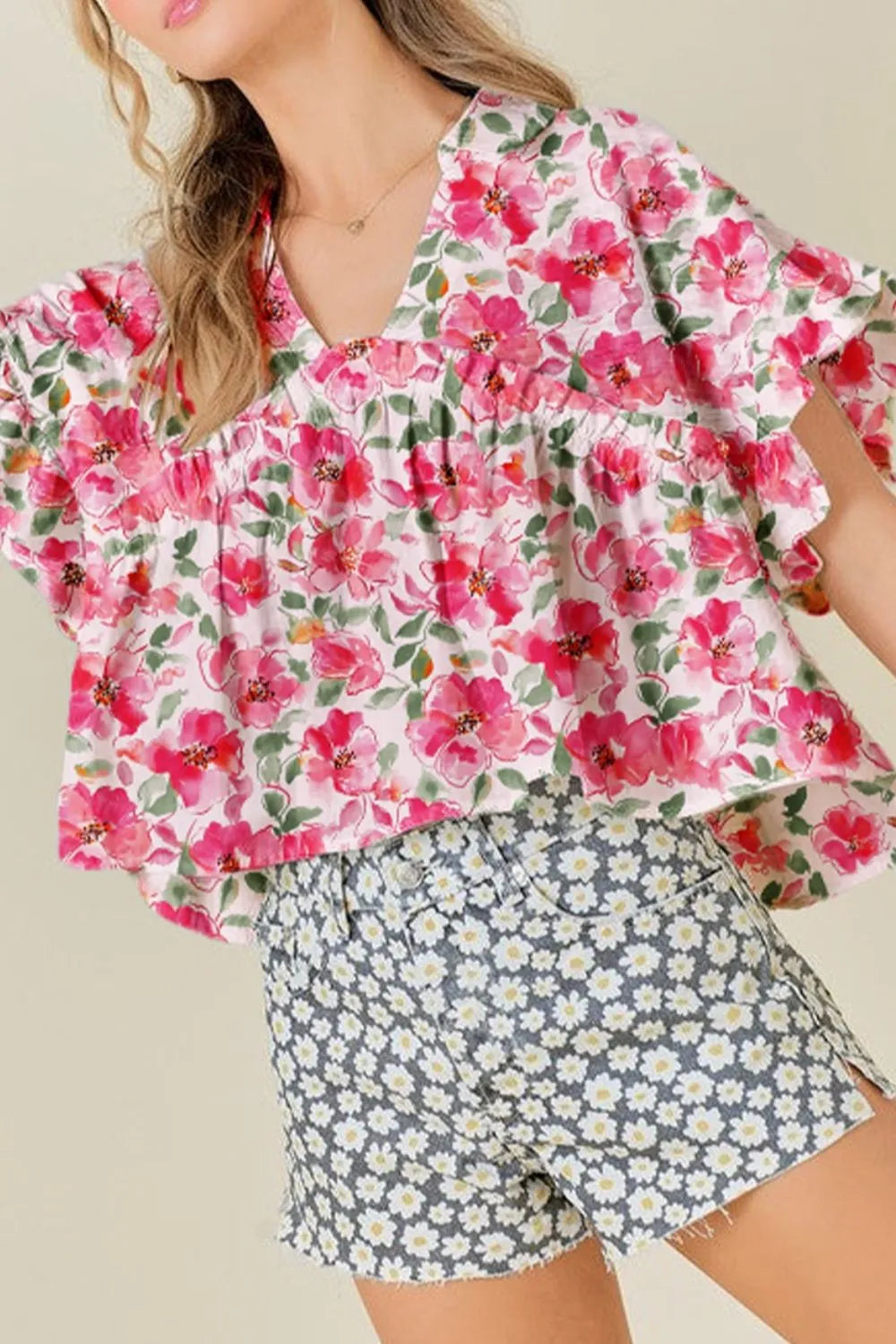 Pink floral boxy fit ruffled short sleeve blouse with v-neckline
