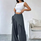 Daverri Wrap-Front Wide-Leg Pants in dark gray with asymmetrical design