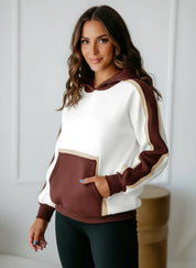 Cream and maroon colorblock hooded sweatshirt with pockets and ribbed cuffs