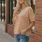 Blush Safari Knit Top: peach leopard-print short-sleeve blouse