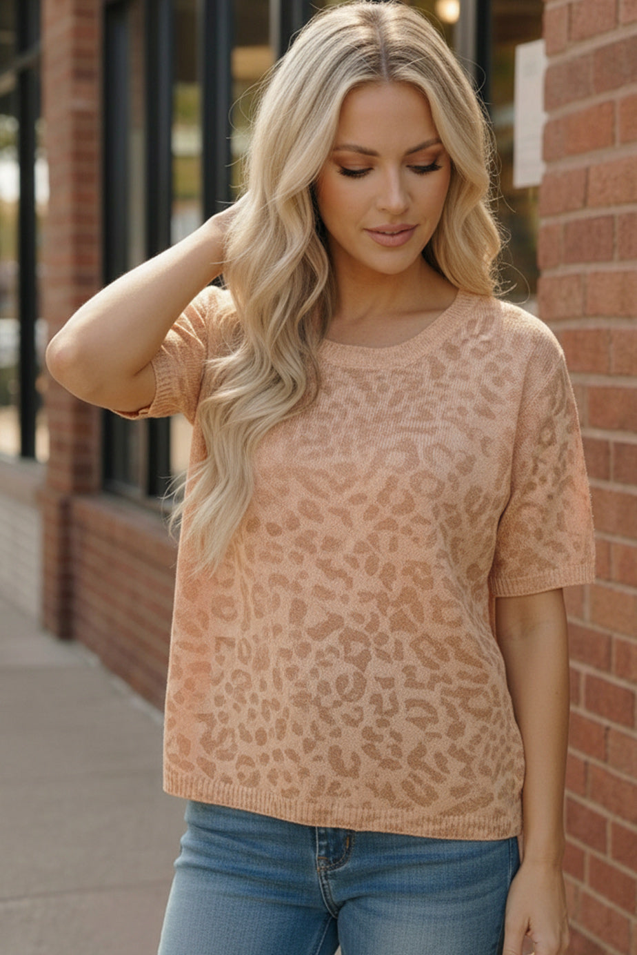 Soft blush safari knit top with subtle leopard print and short sleeves